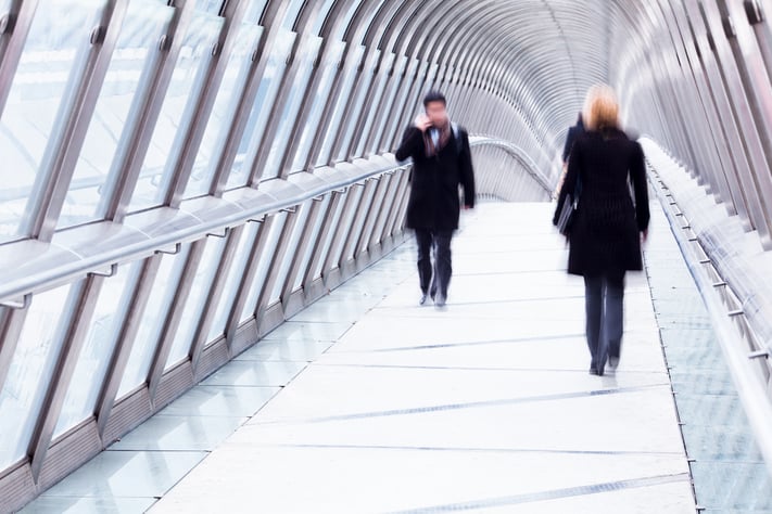 People meeting on a bridge.